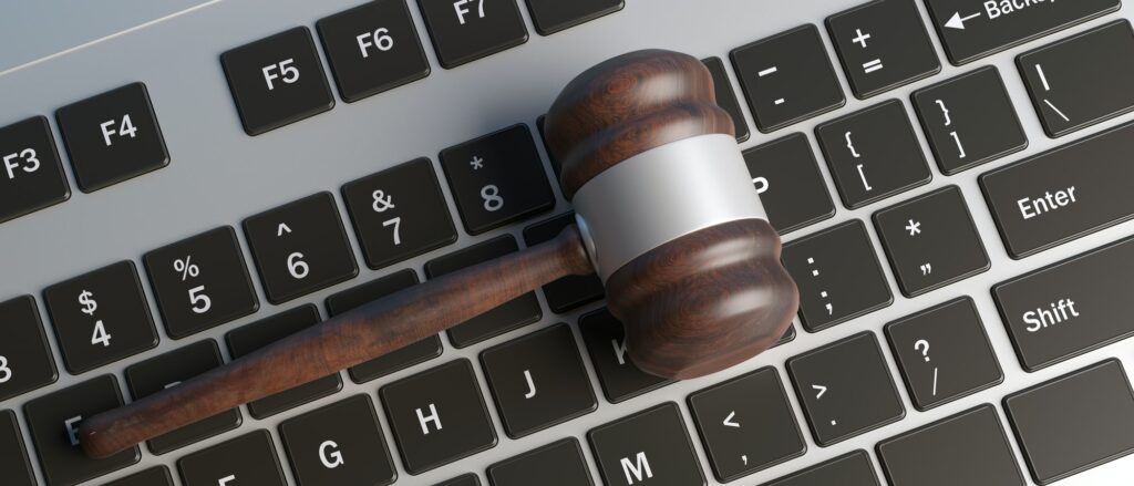 Cyber-Crime-Concept-Law-Gavel-On-Computer-Keyboard-Banner-Top-View-3D-Illustration