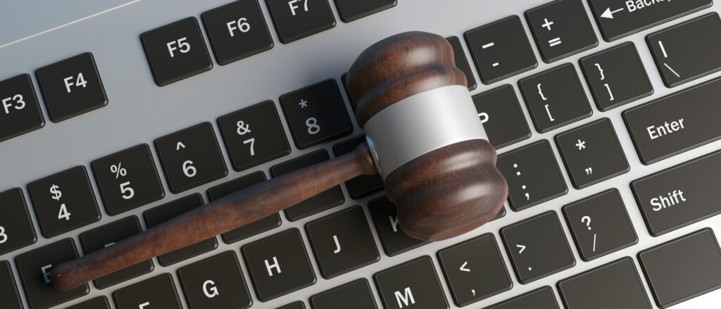 cyber-crime-concept-law-gavel-on-computer-keyboard-banner-top-view-3d-illustration